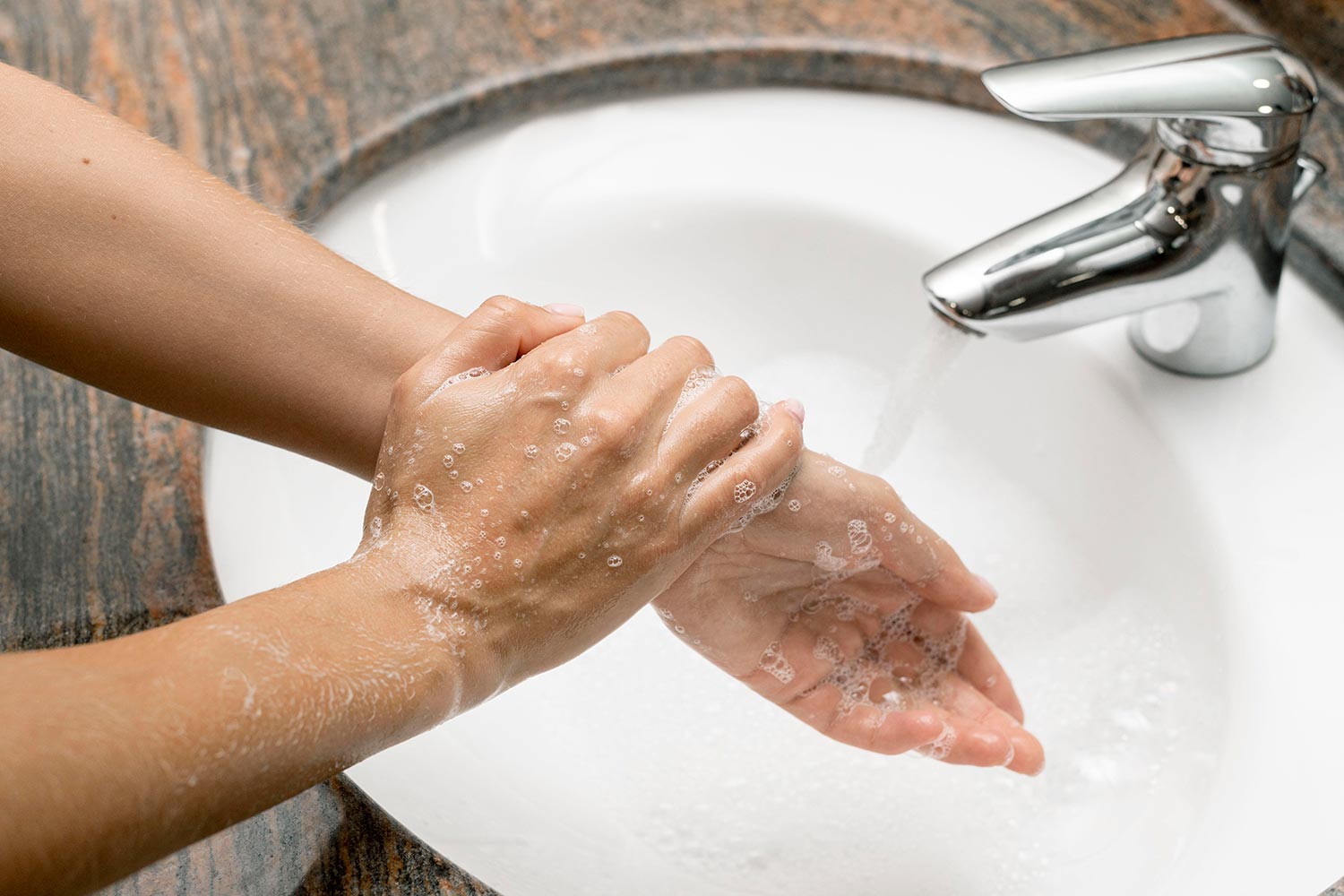 high-angle-woman-washing-hands2